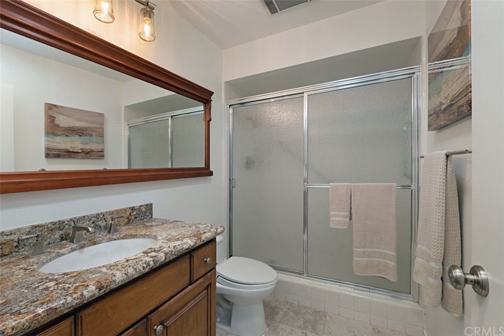 11 Jetty Drive Corona del Mar, CA 92625 - Photo 27 of 44 a bathroom with a granite countertop sink toilet and shower