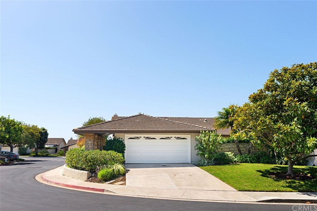 11 Jetty Drive Corona del Mar, CA 92625 - Photo 34 of 44 a front view of a house with a yard