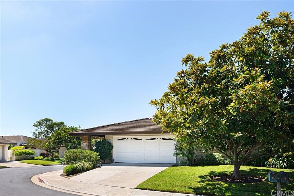 11 Jetty Drive Corona del Mar, CA 92625 - Photo 35 of 44 a front view of a house with a garden