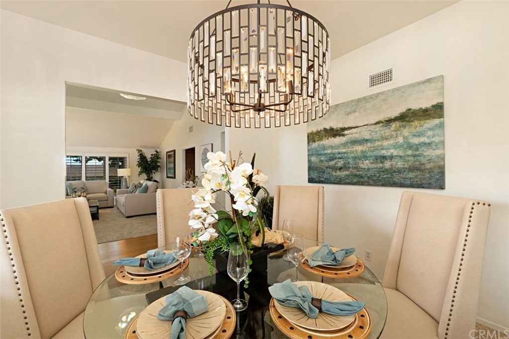 11 Jetty Drive Corona del Mar, CA 92625 - Photo 6 of 44 a living room with furniture and a chandelier