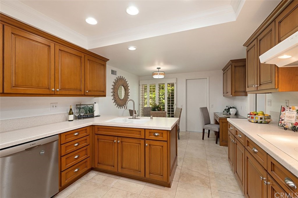 11 Jetty Drive Corona del Mar, CA 92625 - Photo 10 of 44 a kitchen with a sink and cabinets