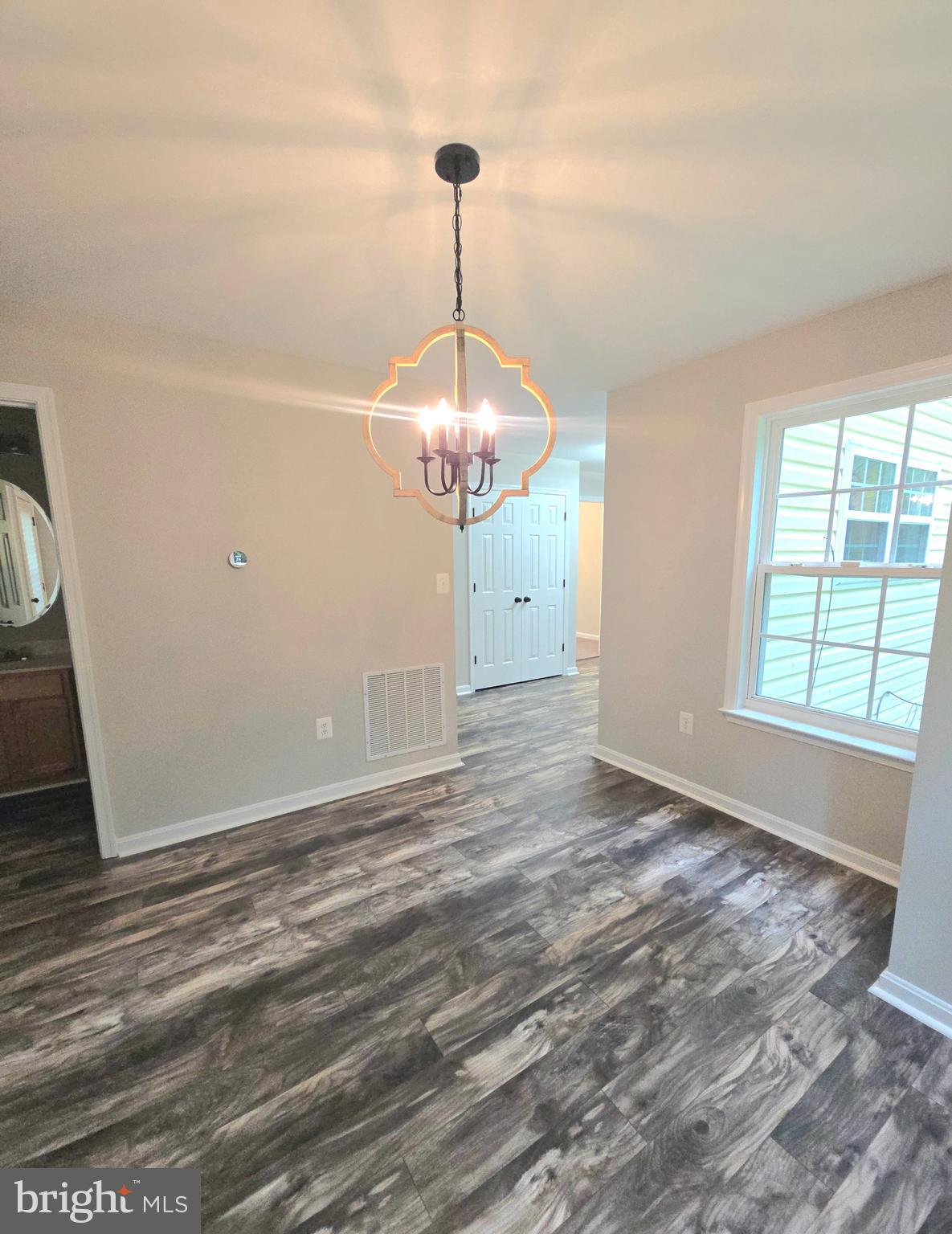 3605 Burton Road Bumpass, VA 23024 - Photo 14 of 44 a view of a room with window and hardwood floor