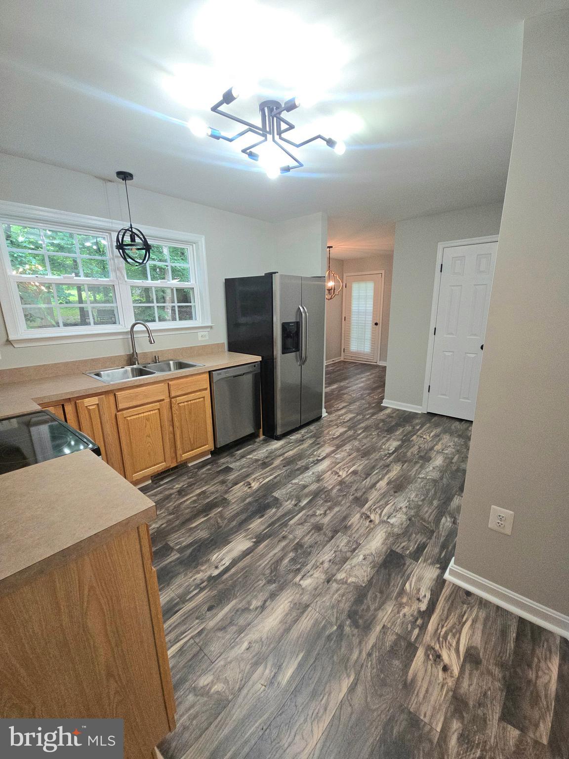 3605 Burton Road Bumpass, VA 23024 - Photo 19 of 44 a room with a bed cabinets and flat screen tv