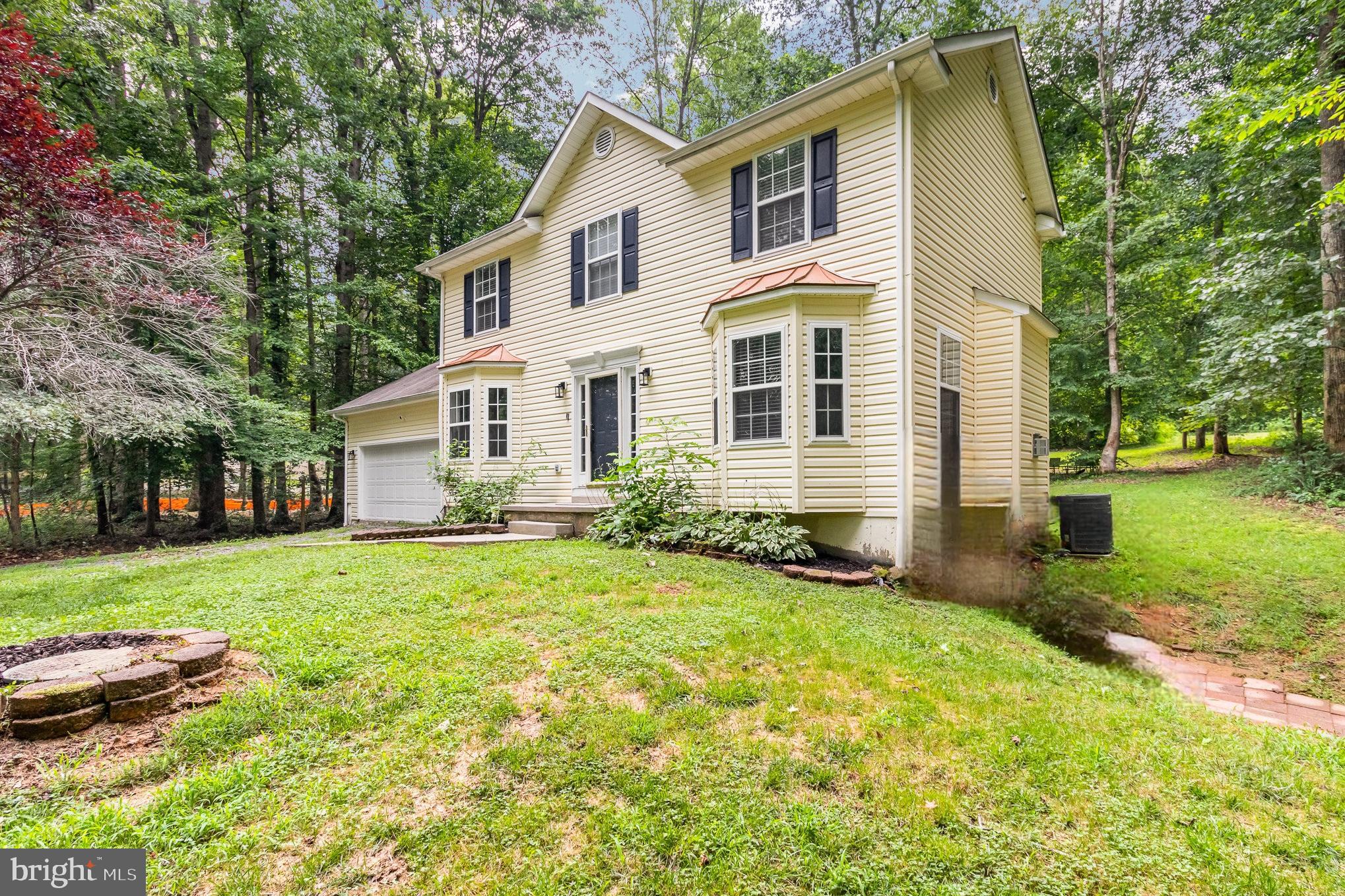 3605 Burton Road Bumpass, VA 23024 - Photo 2 of 44 a front view of a house with a yard