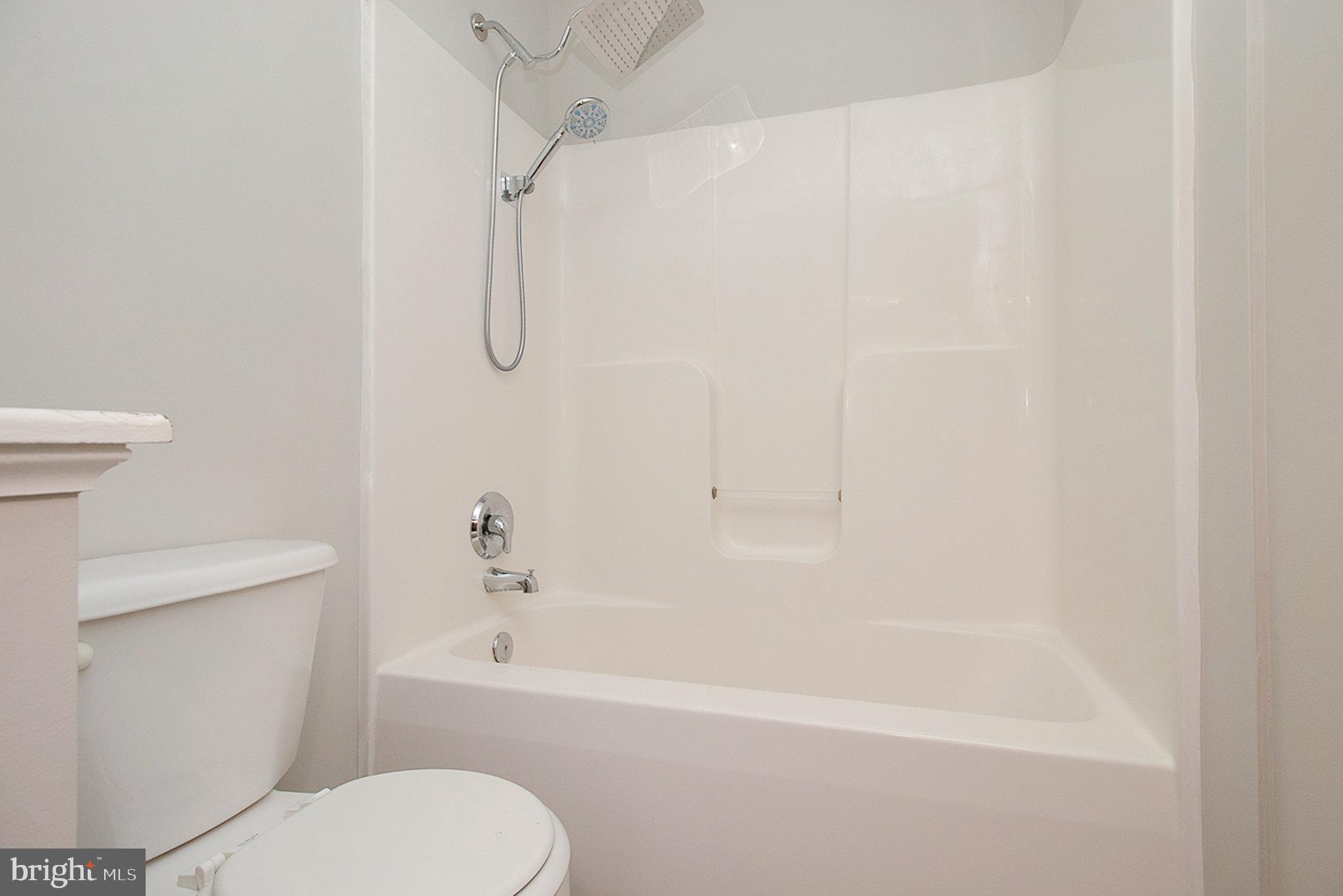 3605 Burton Road Bumpass, VA 23024 - Photo 29 of 44 a bathroom with a toilet and a bathtub