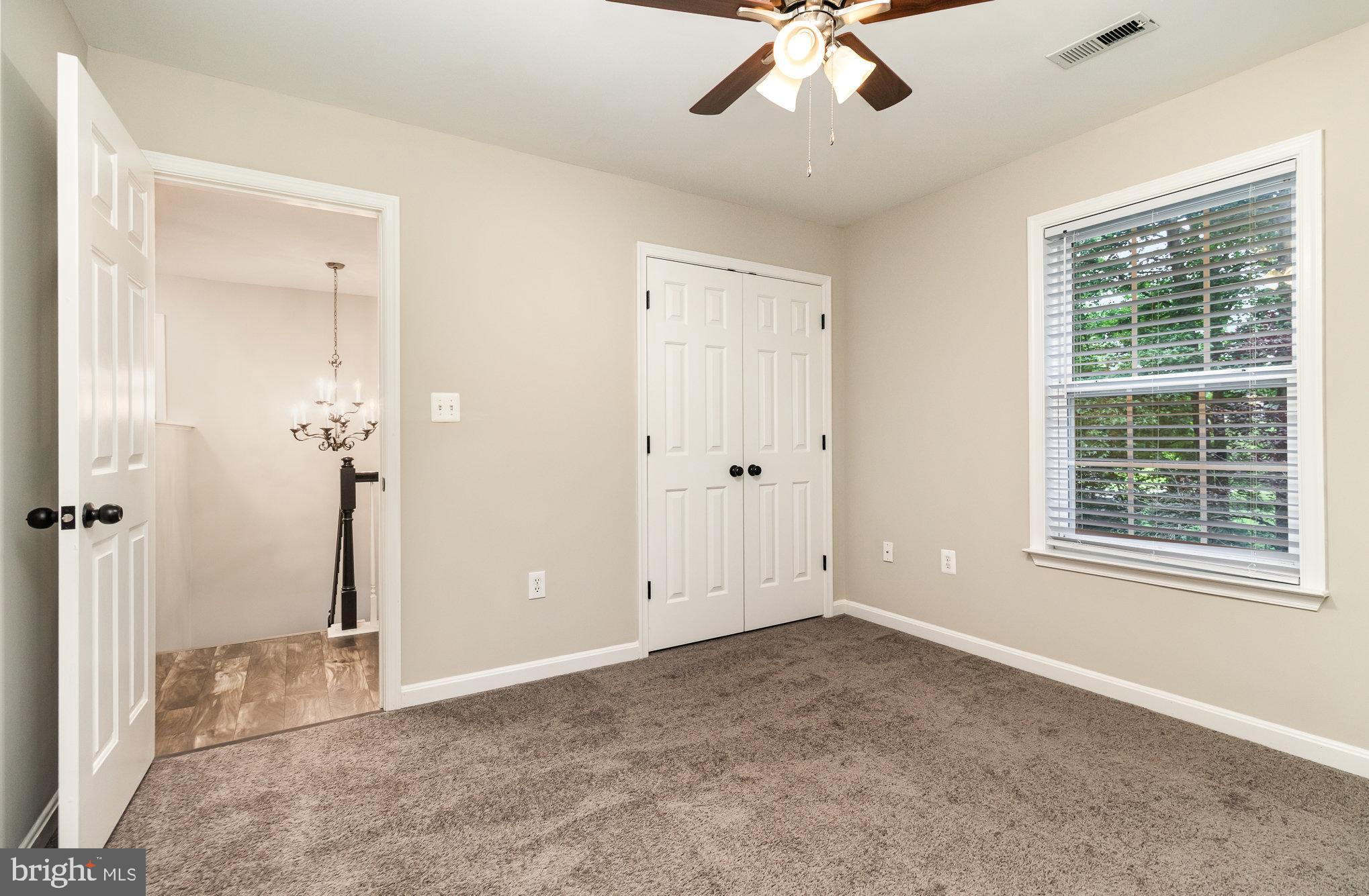 3605 Burton Road Bumpass, VA 23024 - Photo 32 of 44 an empty room with fan and windows