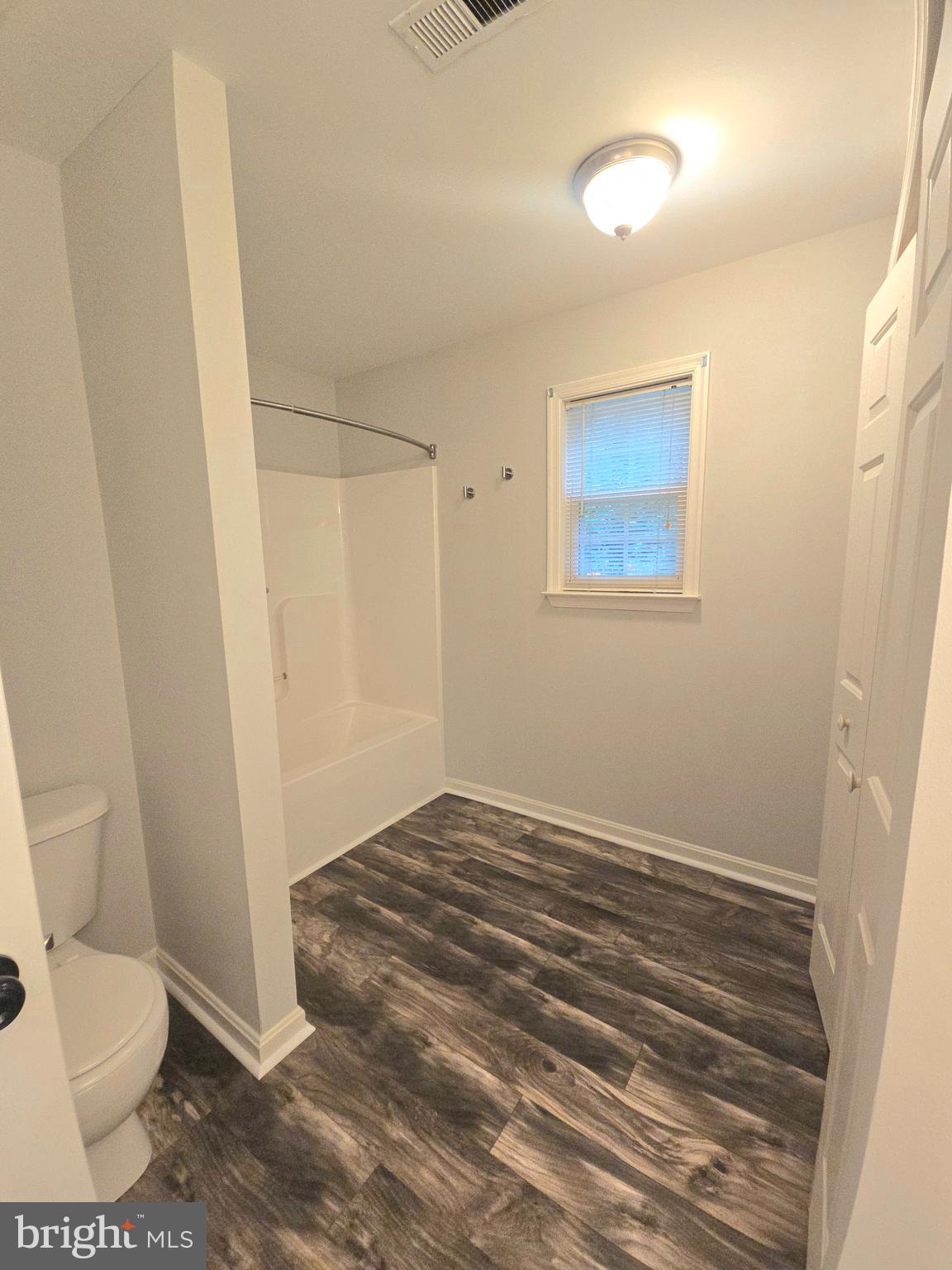 3605 Burton Road Bumpass, VA 23024 - Photo 35 of 44 a bathroom with a toilet and a shower