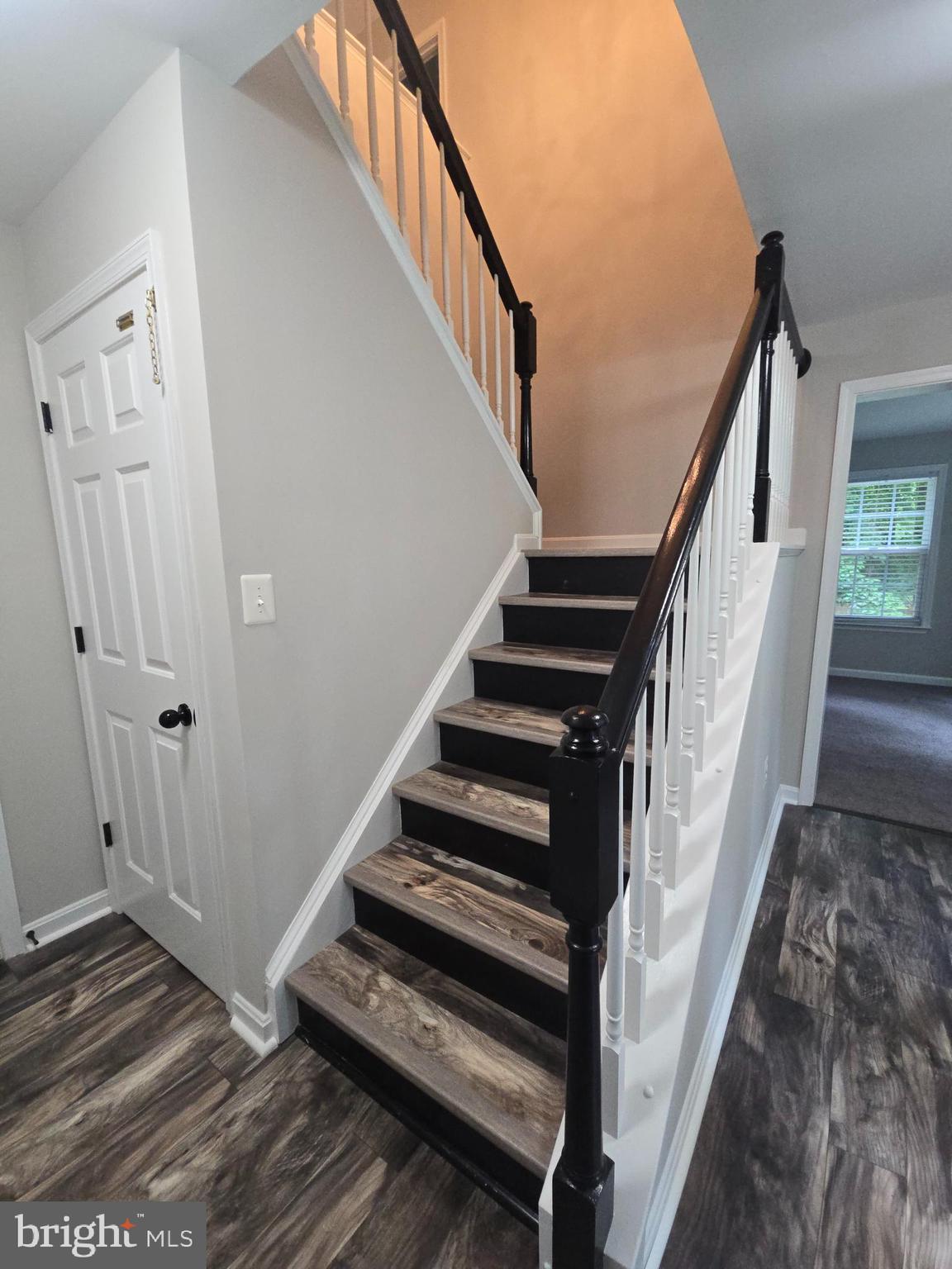 3605 Burton Road Bumpass, VA 23024 - Photo 7 of 44 a view of staircase with wooden floor and white walls