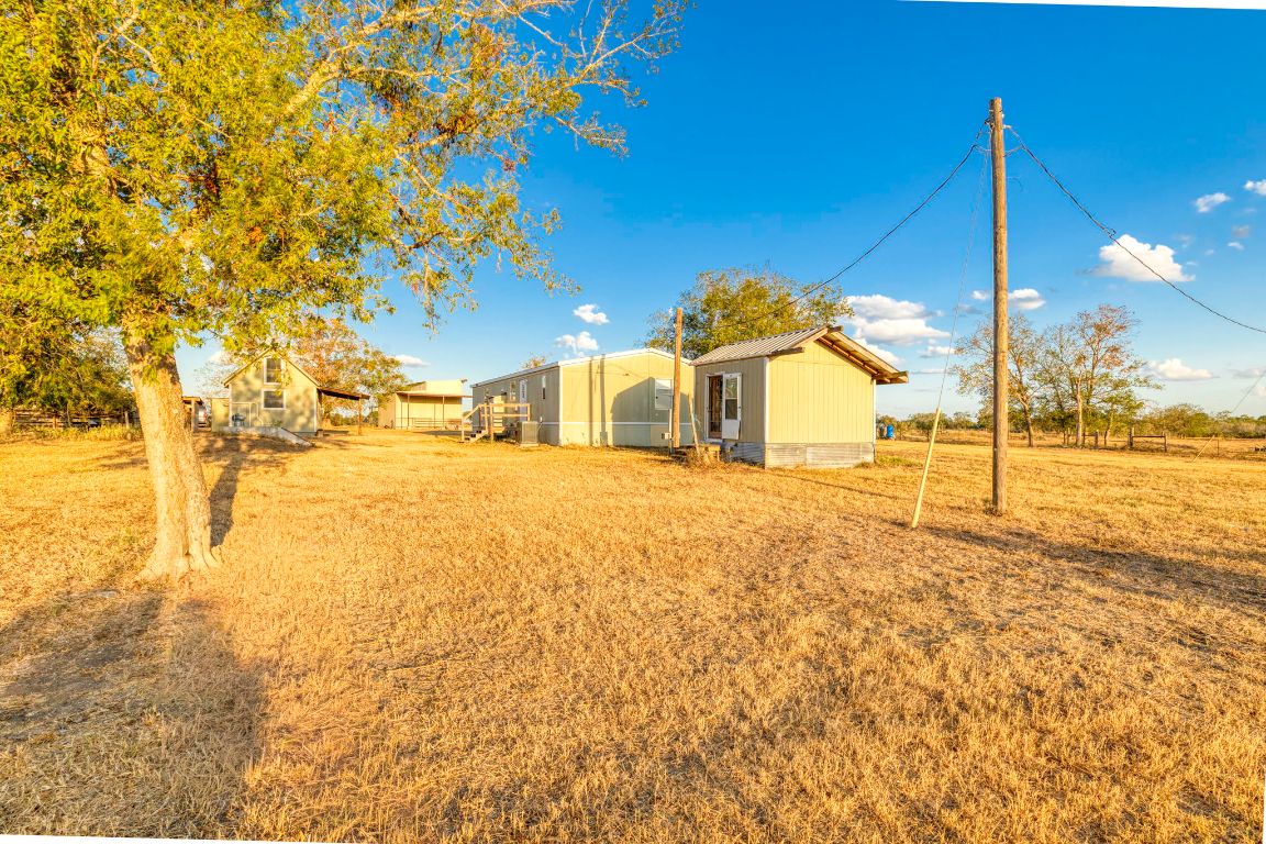645 Old Luling Road Lockhart, TX 78644 - Photo 14 of 24 a view of a swimming pool with a yard