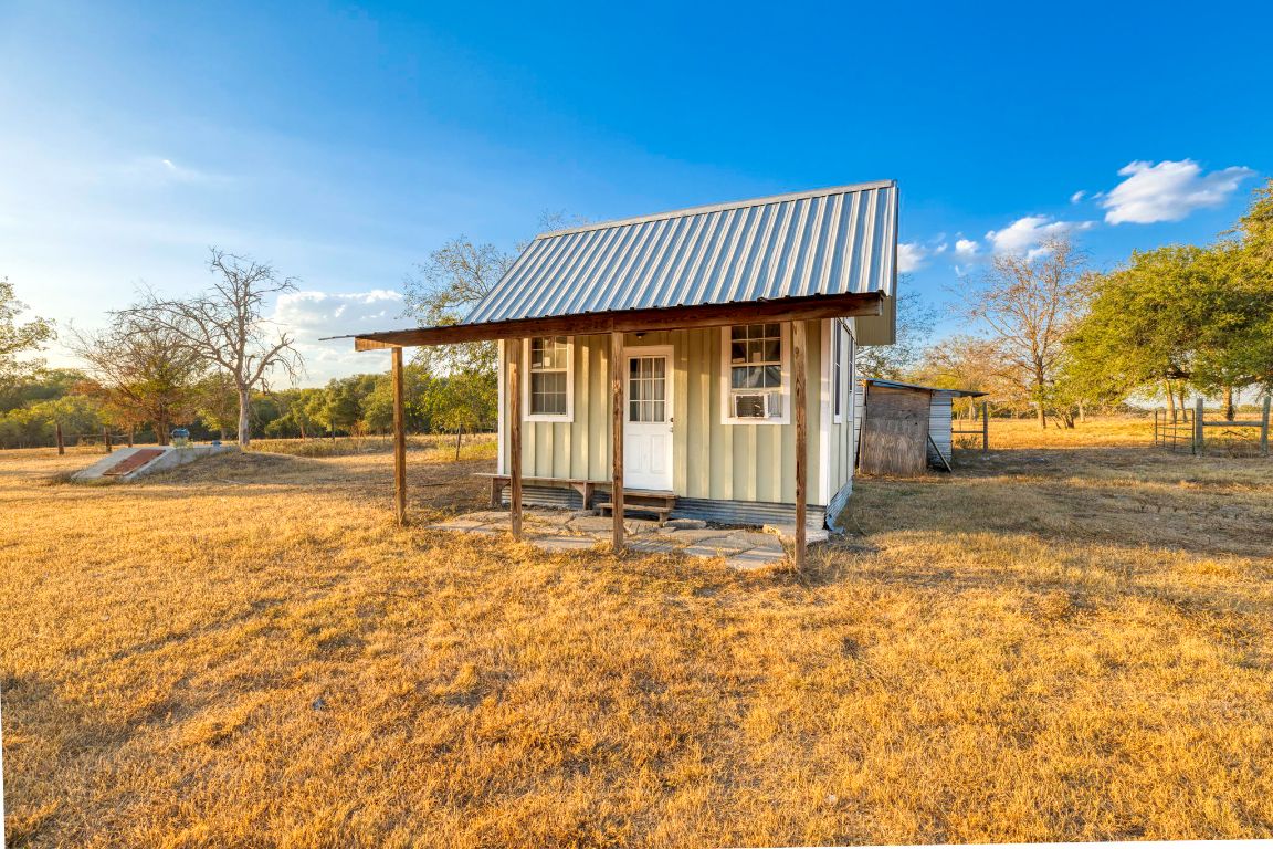 645 Old Luling Road Lockhart, TX 78644 - Photo 17 of 24 a view of a house with a yard