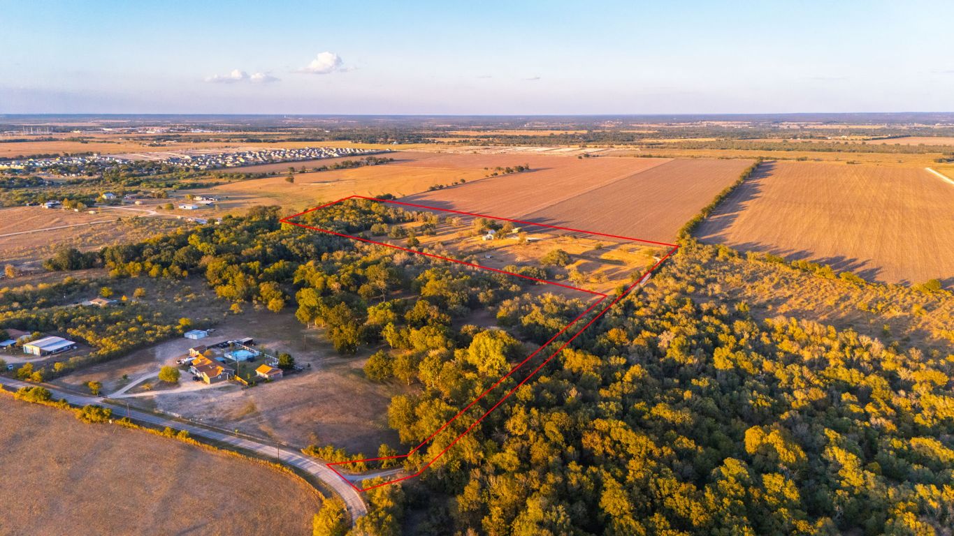 645 Old Luling Road Lockhart, TX 78644 - Photo 23 of 24 an aerial view of residential building and lake