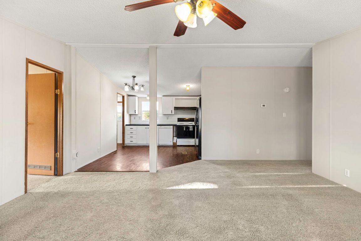 645 Old Luling Road Lockhart, TX 78644 - Photo 5 of 24 a view of a kitchen with a refrigerator and a window