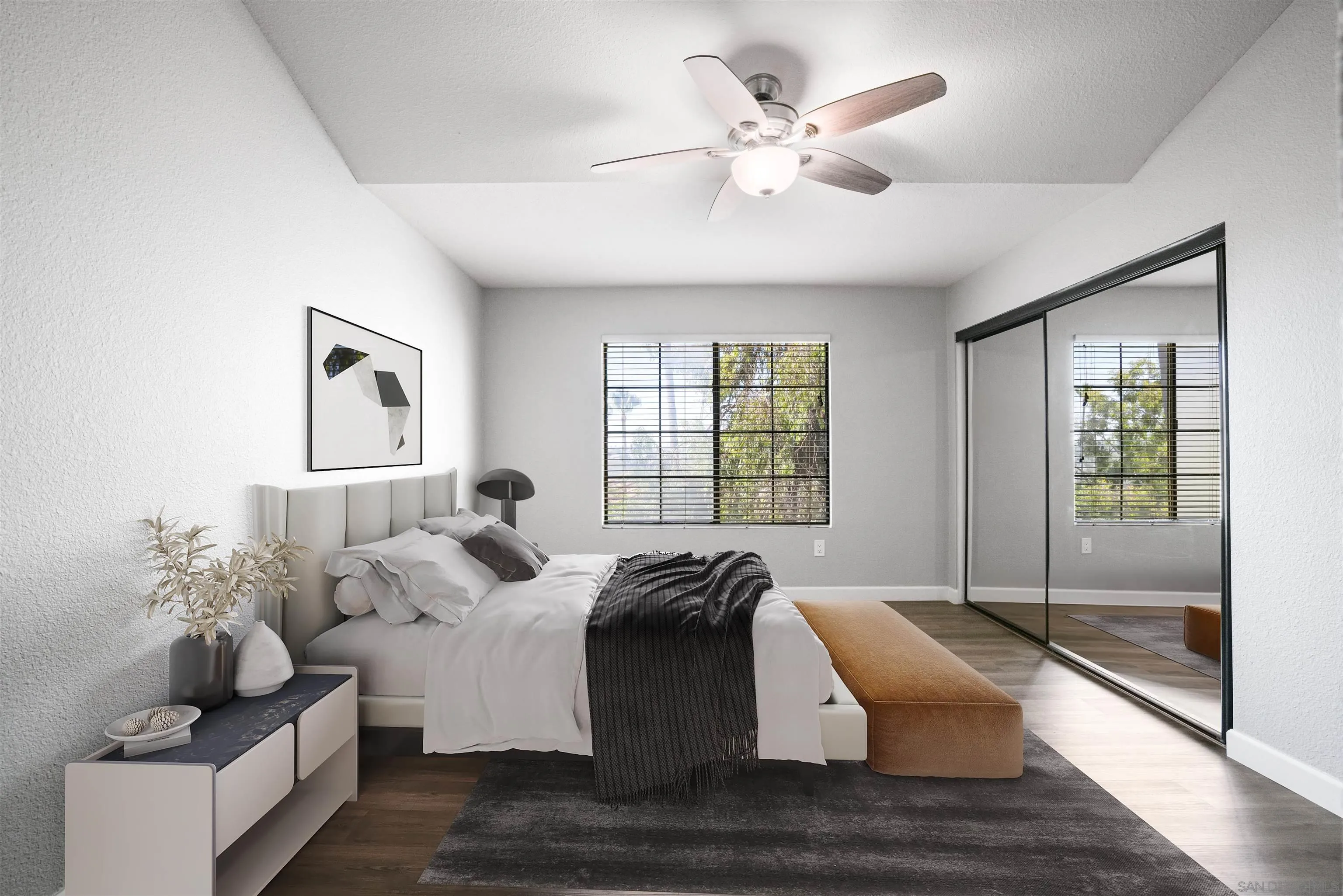 7347 Paseo Verde Carlsbad, CA 92009 - Photo 14 of 27 a large bedroom with a bed and wooden floor