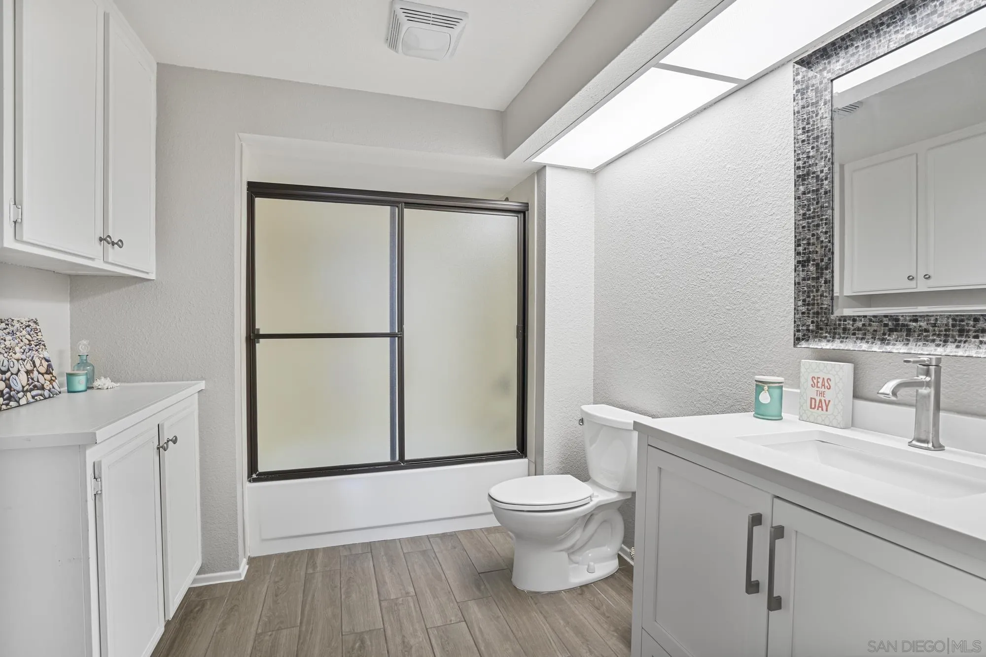 7347 Paseo Verde Carlsbad, CA 92009 - Photo 17 of 27 a bathroom with a sink a toilet and shower