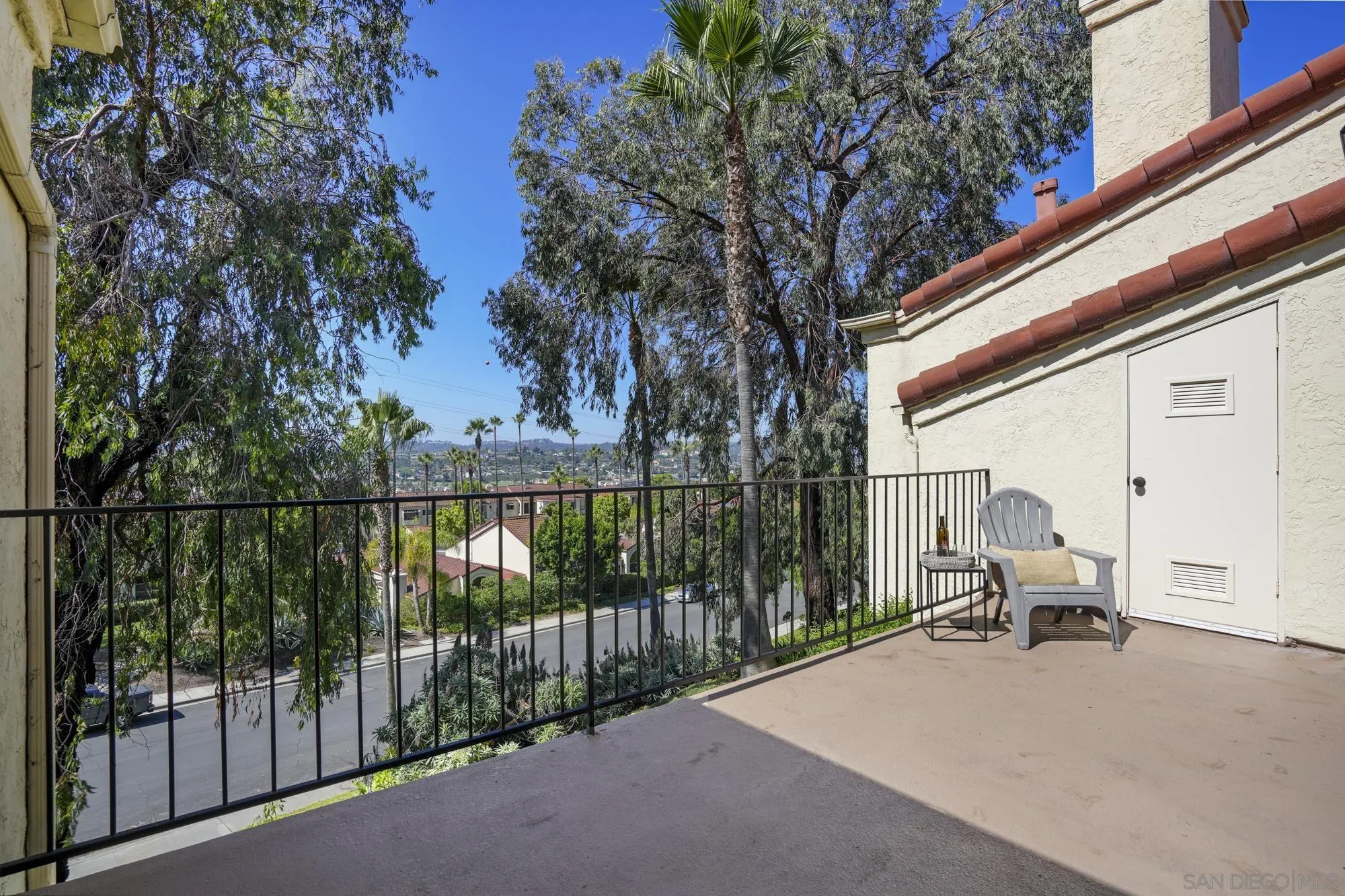 7347 Paseo Verde Carlsbad, CA 92009 - Photo 20 of 27 a view of balcony with couch and wooden fence