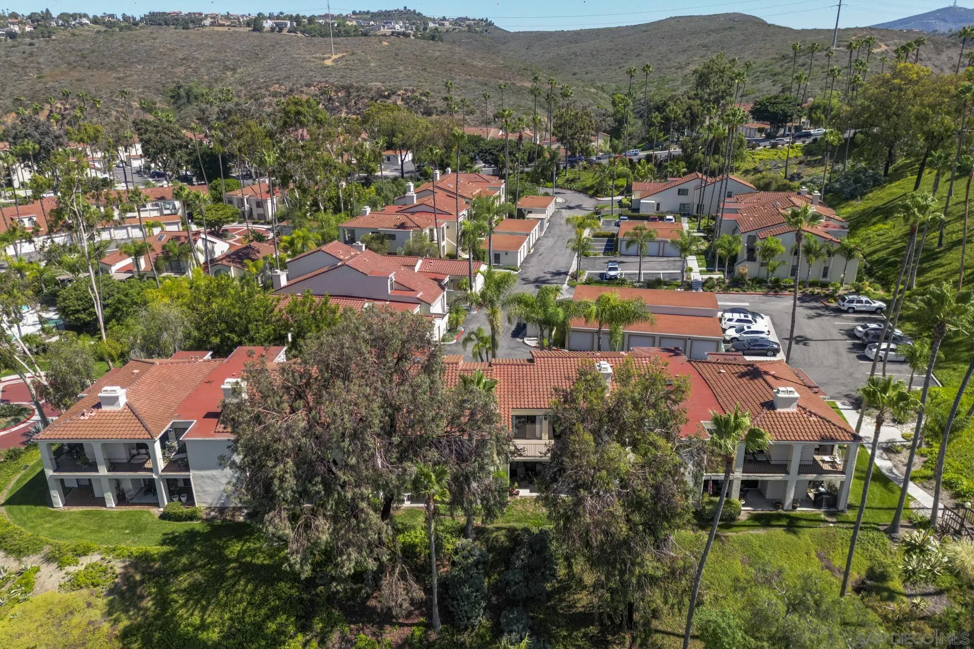 7347 Paseo Verde Carlsbad, CA 92009 - Photo 22 of 27 an aerial view of house with yard and mountain view in back