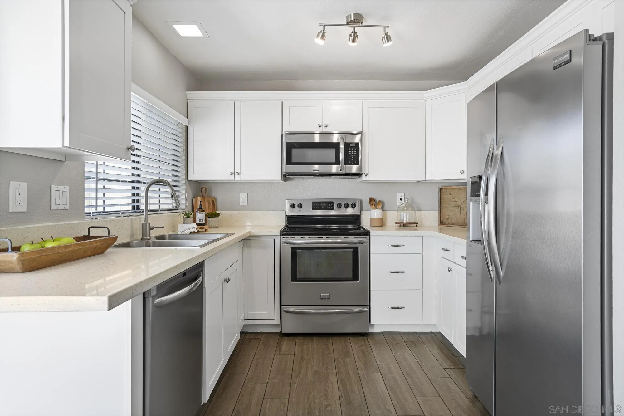 7347 Paseo Verde Carlsbad, CA 92009 - Photo 5 of 27 a kitchen with stainless steel appliances a refrigerator sink and microwave