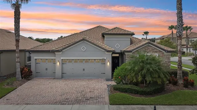 a view of a house with a yard and plants