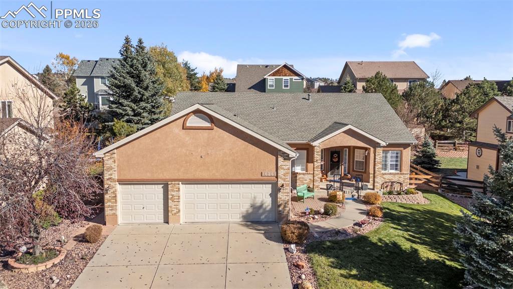 16261 Hobson Place Monument, CO 80132 - Photo 1 of 50 a view of multiple houses with a yard