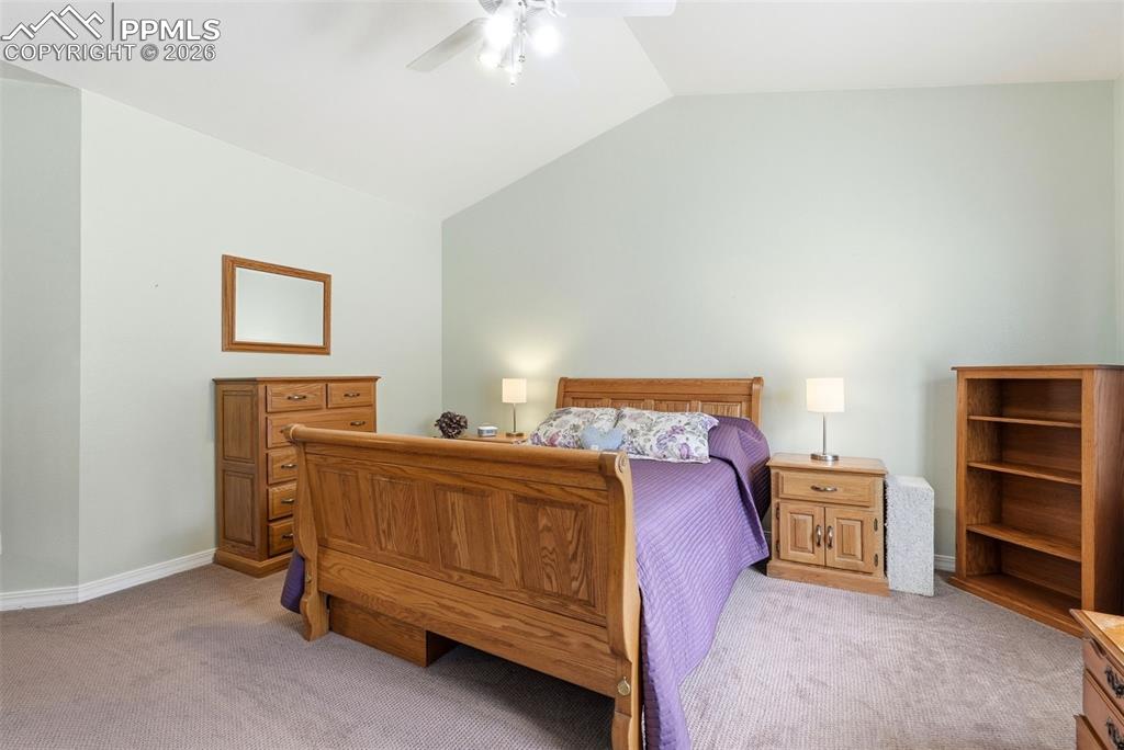 16261 Hobson Place Monument, CO 80132 - Photo 25 of 50 a bed room with a bed and a chair