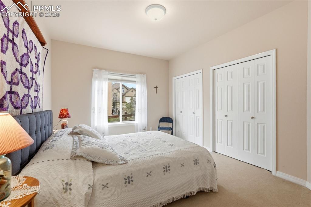 16261 Hobson Place Monument, CO 80132 - Photo 31 of 50 a bedroom with a bed and a window