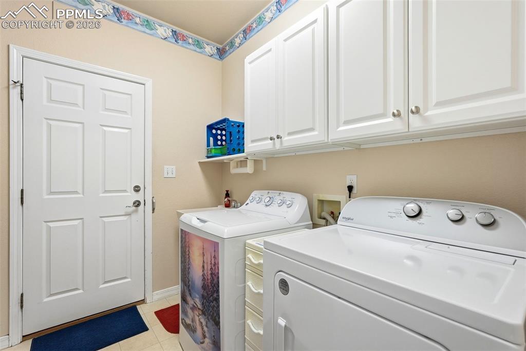 16261 Hobson Place Monument, CO 80132 - Photo 32 of 50 a utility room with dryer and washer