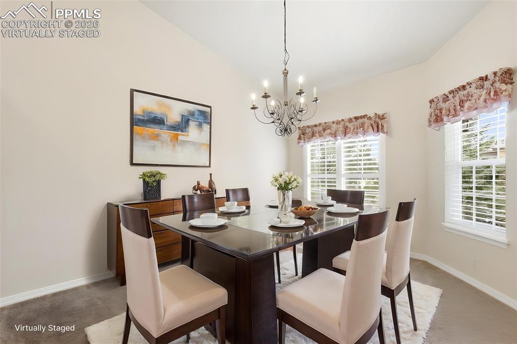 16261 Hobson Place Monument, CO 80132 - Photo 4 of 50 a view of a dining room with furniture window and outside view