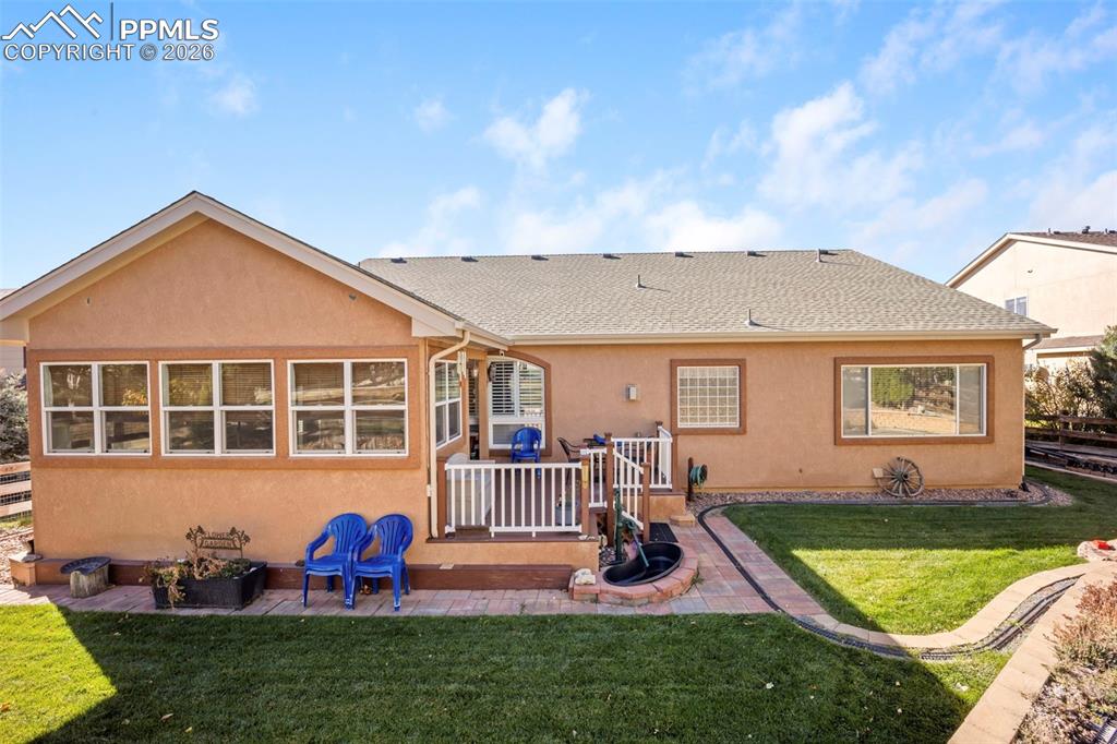 16261 Hobson Place Monument, CO 80132 - Photo 44 of 50 a front view of house with yard and outdoor seating