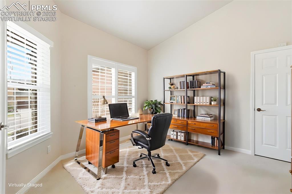 16261 Hobson Place Monument, CO 80132 - Photo 5 of 50 a view of a workspace with furniture and a window