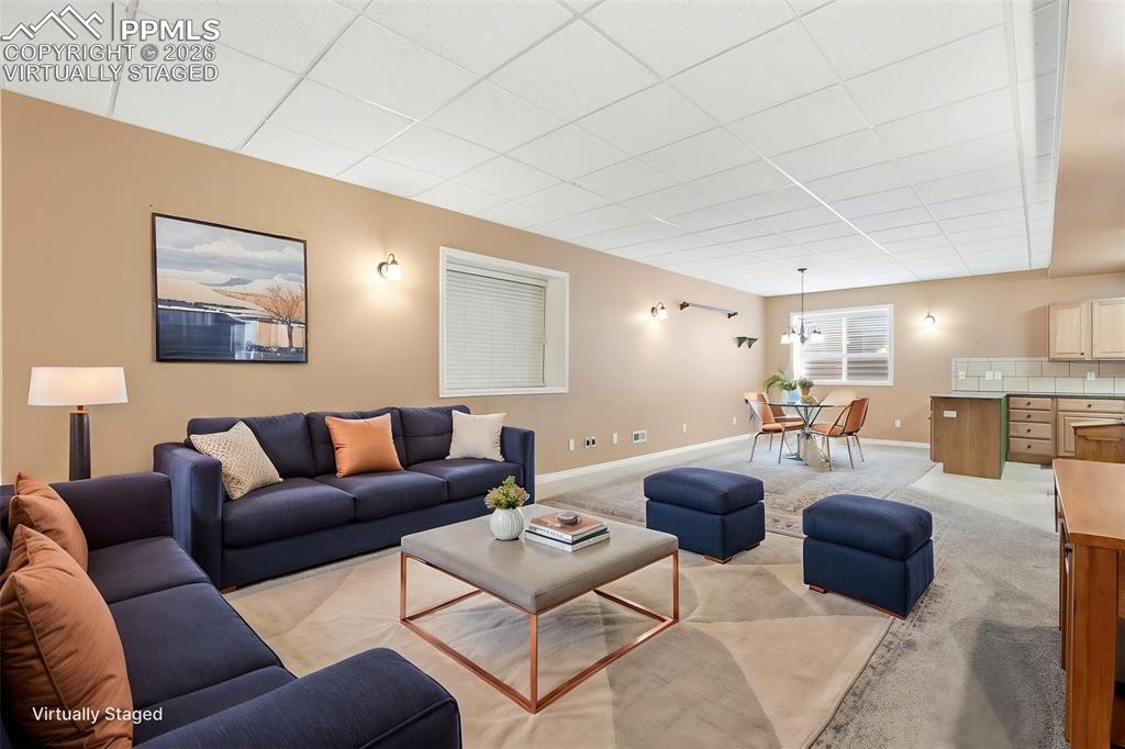 16261 Hobson Place Monument, CO 80132 - Photo 7 of 50 a living room with furniture and a couch