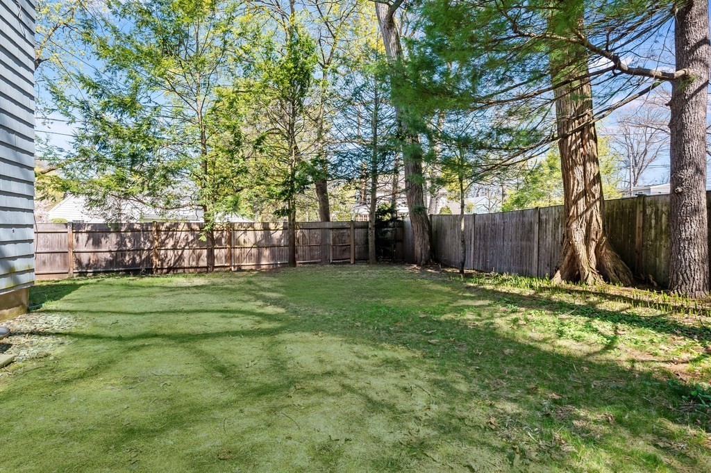 44 Pierrepont Road Newton, MA 02462 - Photo 27 of 29 a backyard of a house with lots of green space