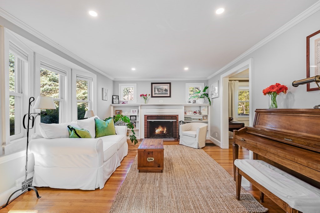 44 Pierrepont Road Newton, MA 02462 - Photo 3 of 29 a living room with furniture and a fireplace