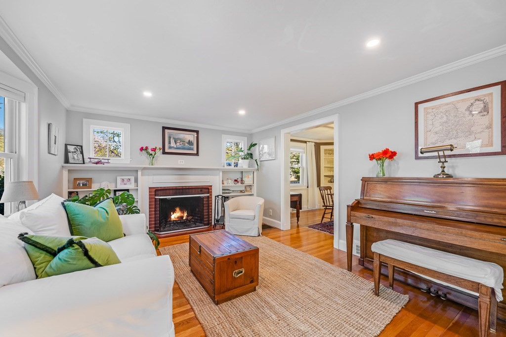 44 Pierrepont Road Newton, MA 02462 - Photo 4 of 29 a living room with furniture and a fireplace