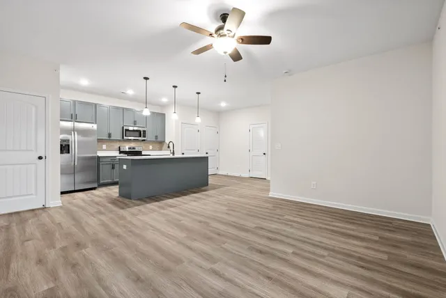 a view of kitchen with wooden floor
