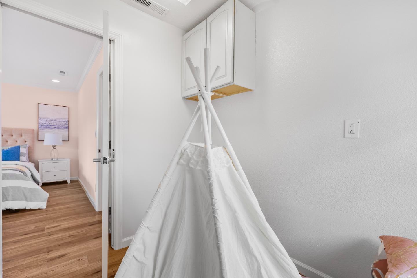 983 Smith Avenue Campbell, CA 95008 - Photo 34 of 57 a view of a room with wooden floor and stairs