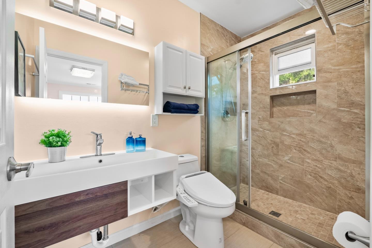 983 Smith Avenue Campbell, CA 95008 - Photo 36 of 57 a bathroom with a sink a toilet and shower