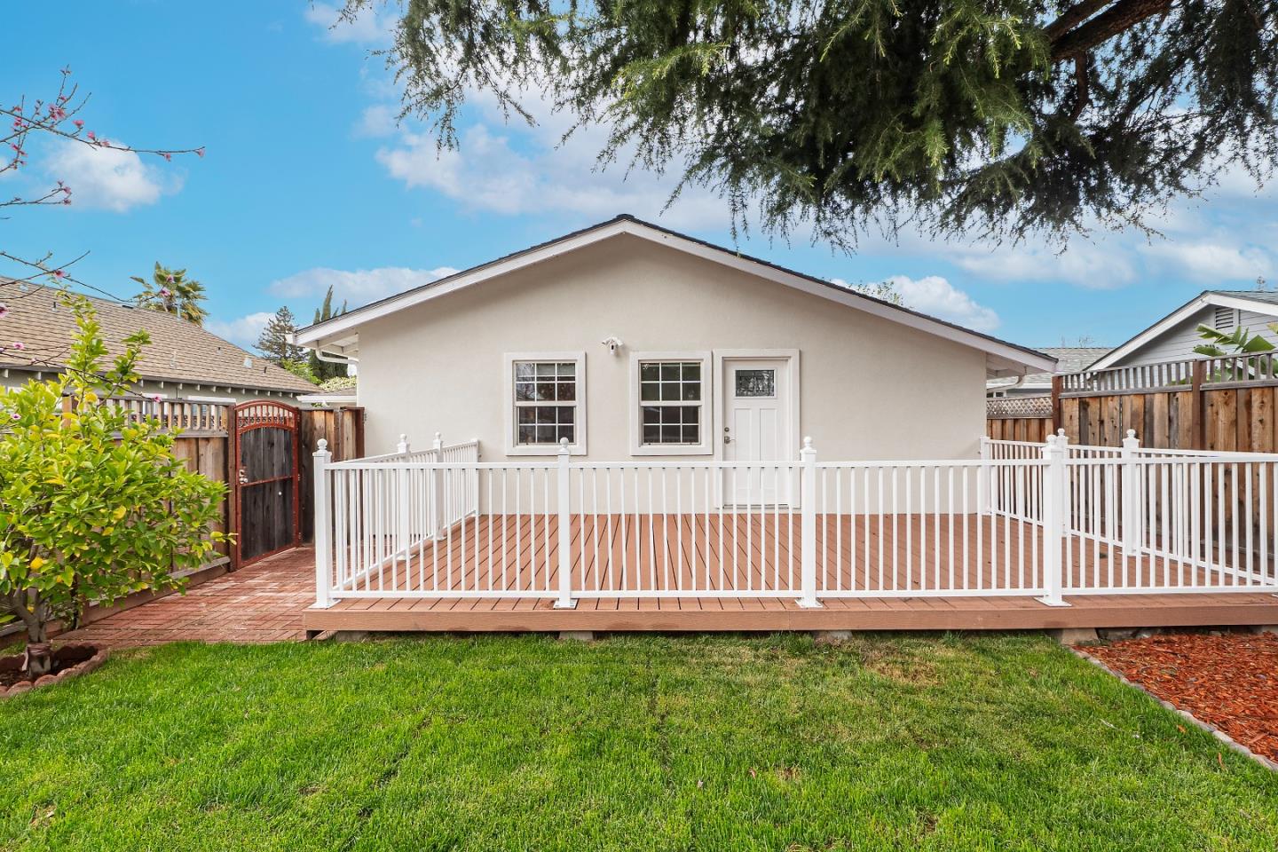 983 Smith Avenue Campbell, CA 95008 - Photo 40 of 57 a view of a house with a yard and deck