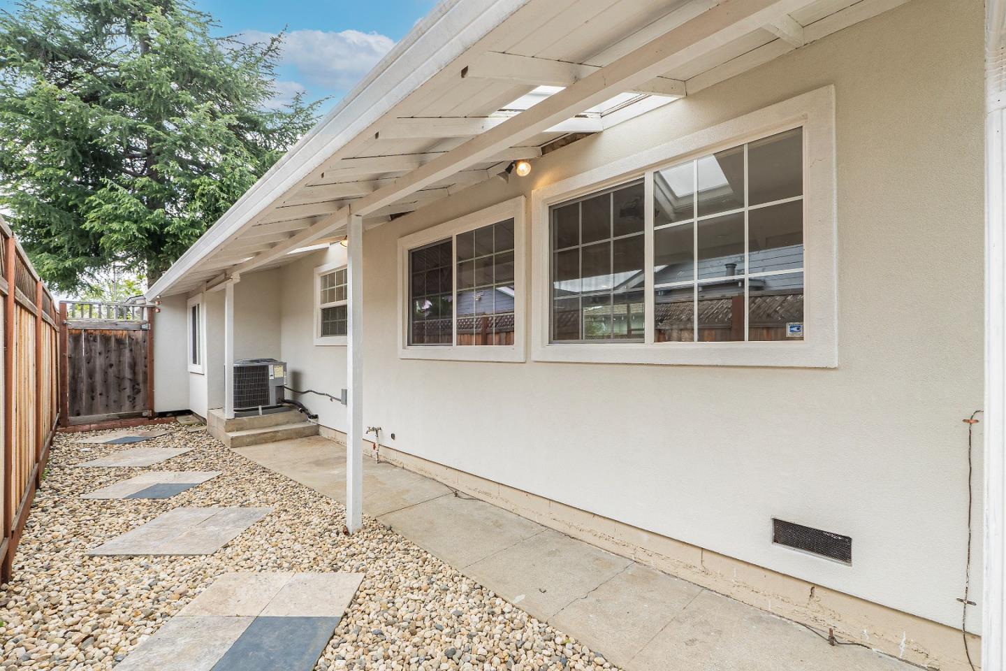 983 Smith Avenue Campbell, CA 95008 - Photo 43 of 57 a house with trees in the background
