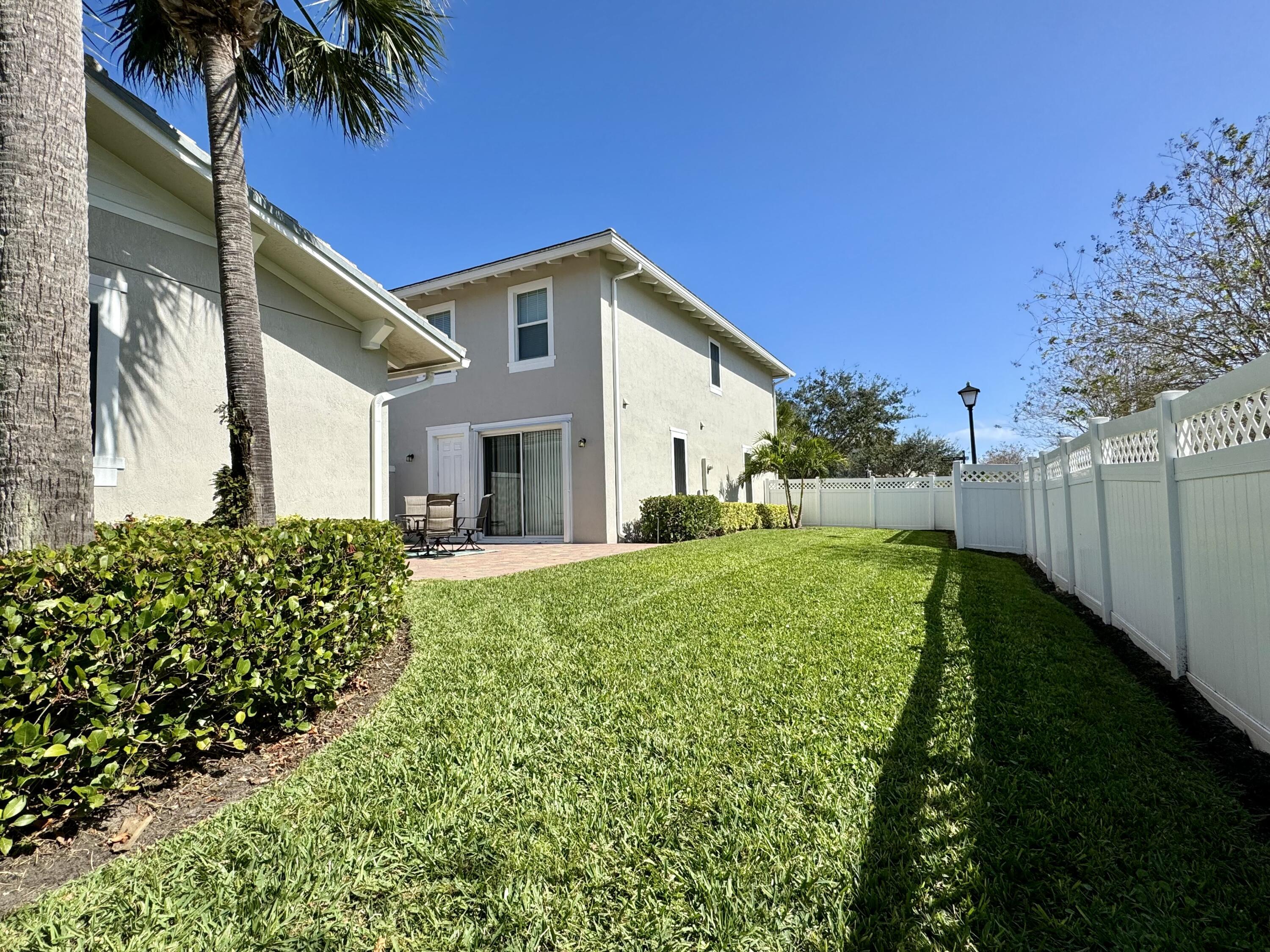 2758 Avalon Way Jupiter, FL 33458 - Photo 3 of 51 a view of a house with backyard and garden