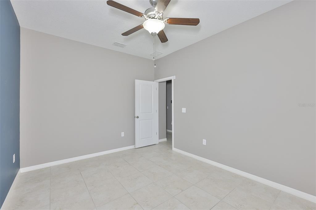 6330 Lantern View Place Apollo Beach, FL 33572 - Photo 16 of 64 an empty room with closet and a chandelier fan