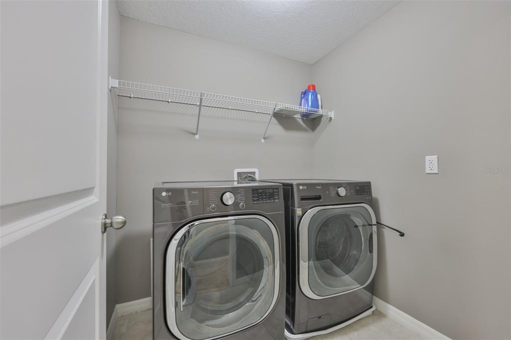 6330 Lantern View Place Apollo Beach, FL 33572 - Photo 20 of 64 a utility room with dryer and washer