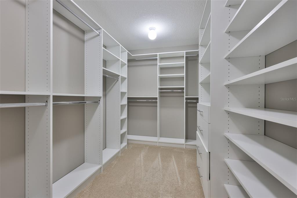 6330 Lantern View Place Apollo Beach, FL 33572 - Photo 24 of 64 a view of walk in closet with empty racks