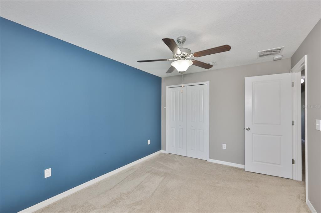 6330 Lantern View Place Apollo Beach, FL 33572 - Photo 29 of 64 an empty room with a ceiling fan and a window