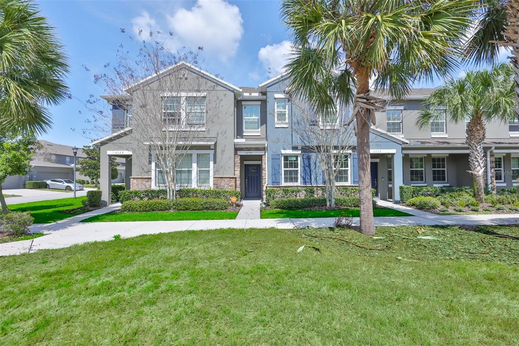6330 Lantern View Place Apollo Beach, FL 33572 - Photo 3 of 64 a front view of a house with a yard and palm trees
