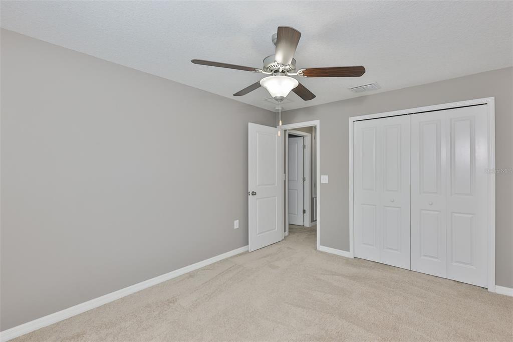 6330 Lantern View Place Apollo Beach, FL 33572 - Photo 34 of 64 a view of an empty room and chandelier fan