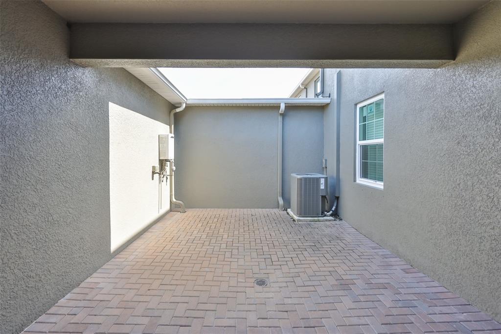 6330 Lantern View Place Apollo Beach, FL 33572 - Photo 37 of 64 a view of empty room with wooden floor and fan