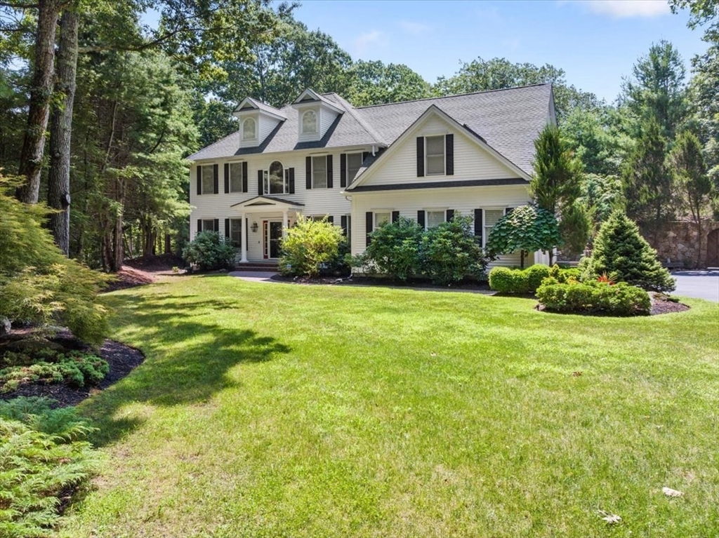 15 A Moccasin Path Natick, MA 01760 - Photo 1 of 42 a front view of house with yard and green space