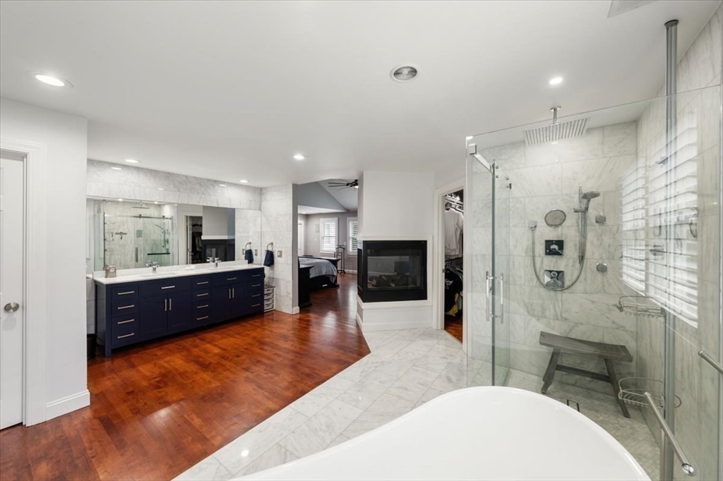15 A Moccasin Path Natick, MA 01760 - Photo 13 of 42 a large en suite bathroom with sink shower and mirror