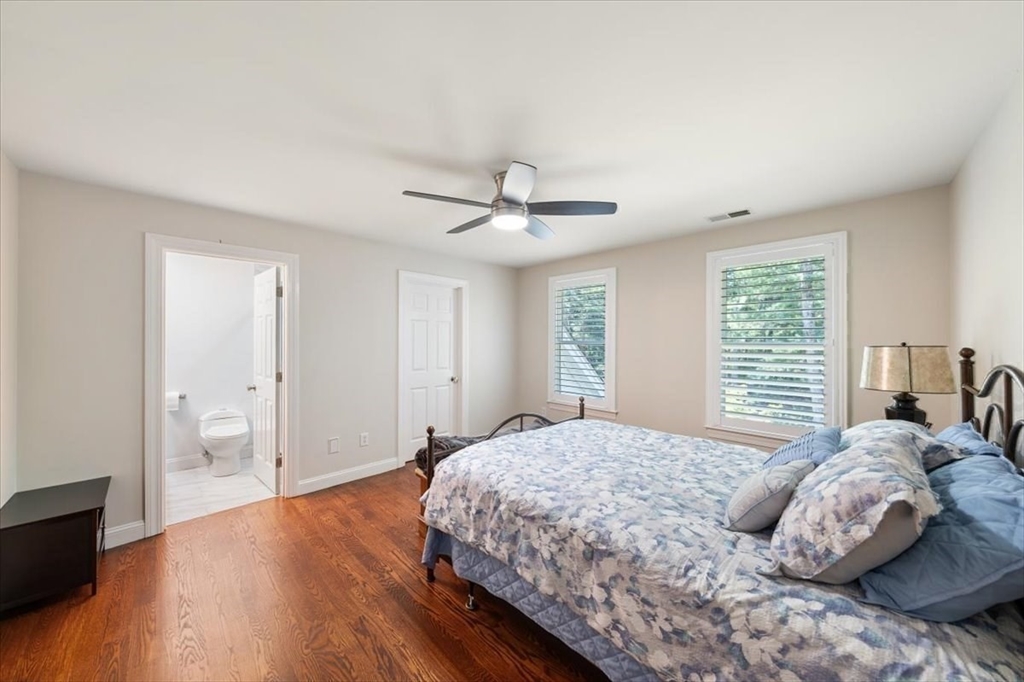 15 A Moccasin Path Natick, MA 01760 - Photo 17 of 42 a bedroom with a large bed and a window