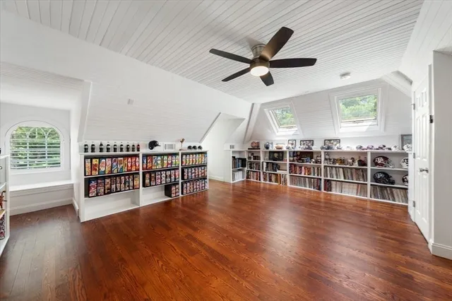 a view of a livingroom with hardwood floor and a ceiling fan